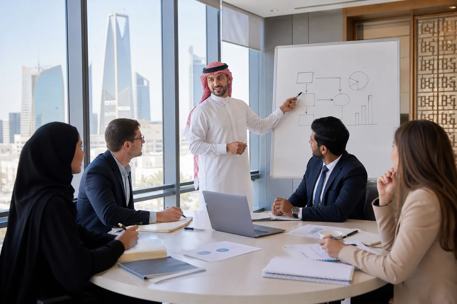 Saudi and international finance professionals comparing US CMA and ACCA study paths in a Riyadh workshop