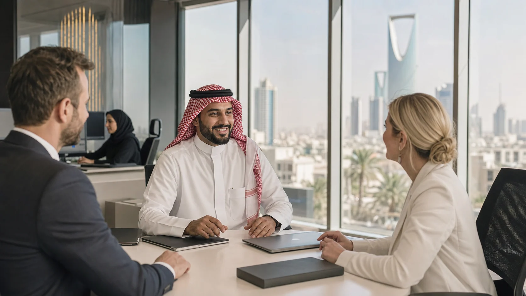 Saudi trade-finance professionals discussing a successful documentary-credit transaction in Riyadh