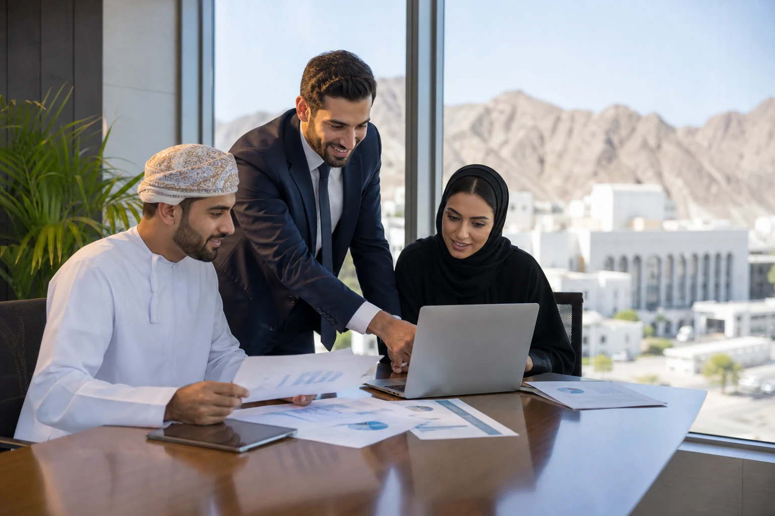 Oman accounting professionals reviewing financial reports