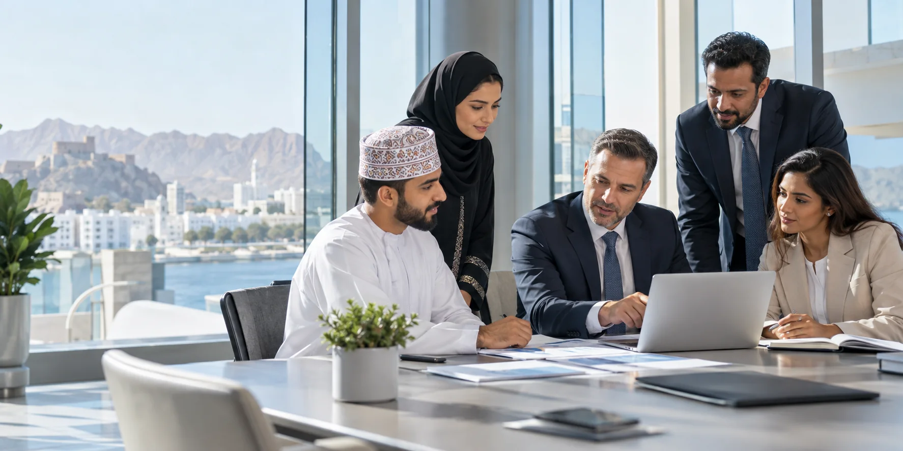 Finance and audit professionals reviewing business performance in Muscat
