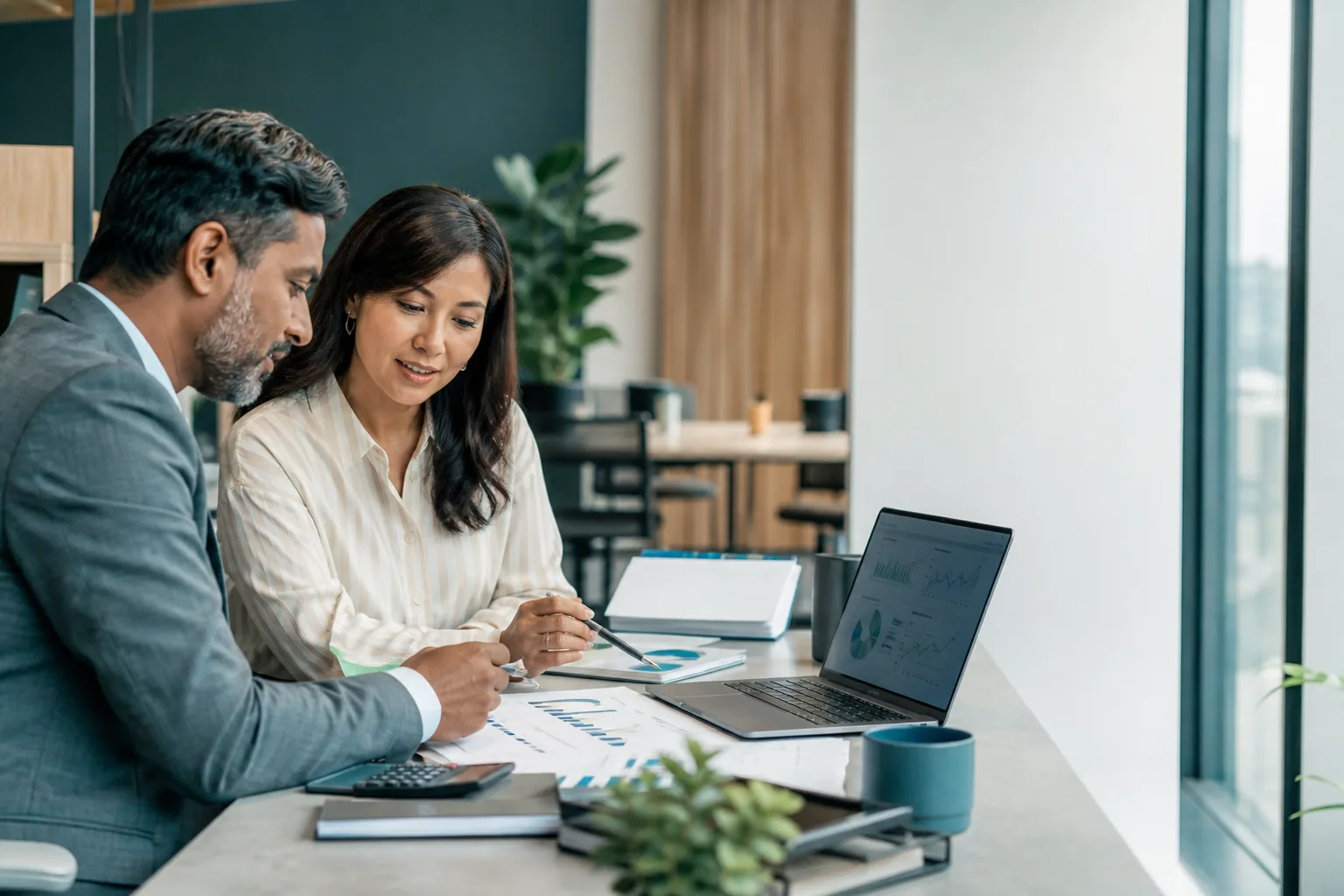 Management-finance professionals reviewing planning and performance data